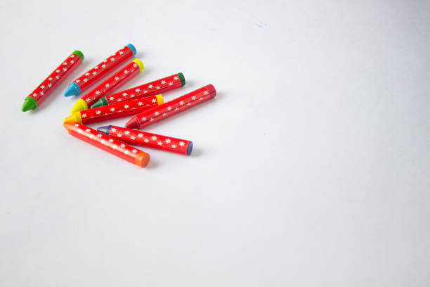 istock Jumbled group of multi-coloured wax crayons on white 1086901458