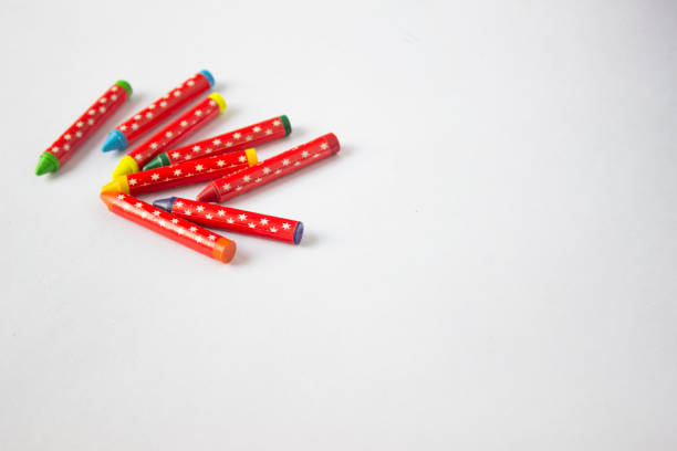 istock Jumbled group of multi-coloured wax crayons on white 1086901464