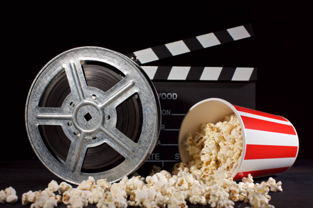 istock film reel and clapboard with popcorn 1086904140