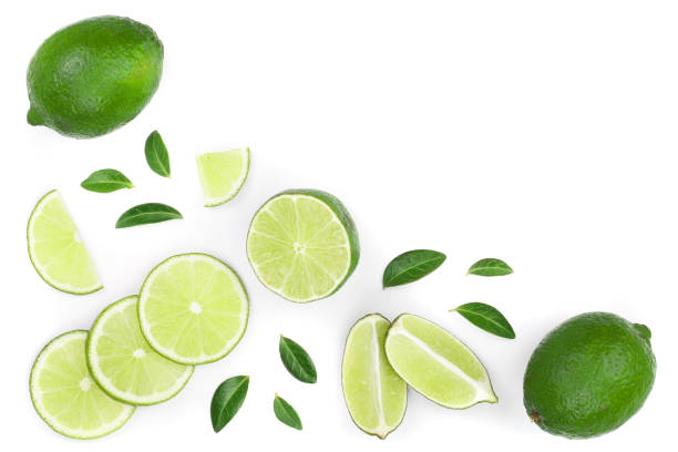 istock sliced lime vith leaves isolated on white background with copy space for your text. Top view. Flat lay pattern 1086904378