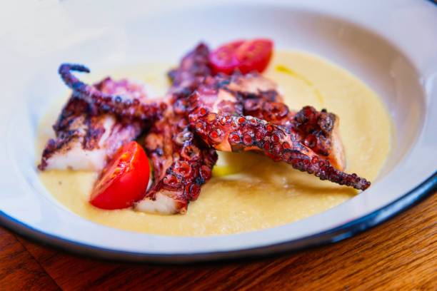 istock Mediterranean Octopus with vegetables and potatoes 1086908352