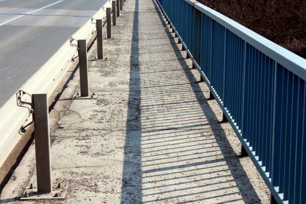 istock Bridge sidewalk with guardrail and fence 1086908576