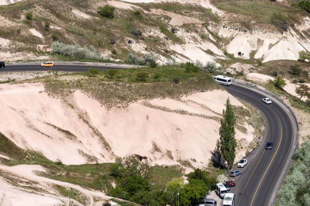 istock A winding asphalt road among the hills 1086908670