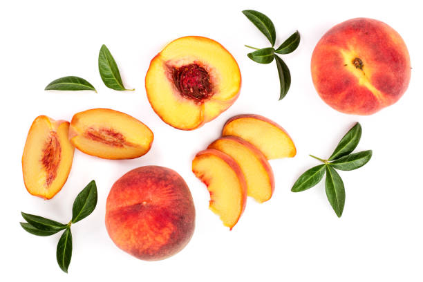 istock ripe peaches with leaves isolated on white background. Top view. Flat lay pattern 1086908700