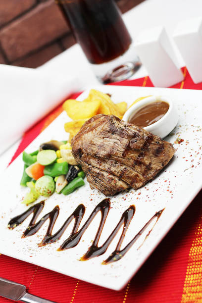 beef tenderloin steak with garnish on the table