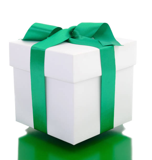 istock White gift box with green ribbon. 1086912444