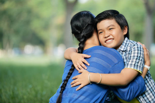 istock Boy embracing his mother 1086913914