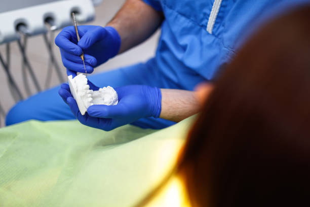 istock Dentist showing how new dentals will look 1086914770
