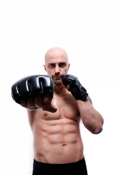 istock Sexy young man pointing with black boxing glove 108691537