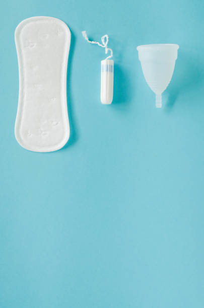 istock Menstrual cup, sanitary pad and tampon on a blue background. 1086919794