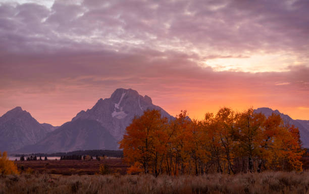 istock Sun setting on the Teton Mountain Range, Grand Teton National Park 1086921940