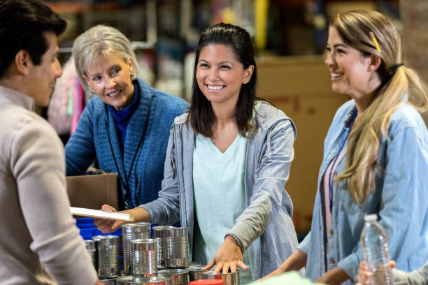 istock Food bank manager instructs volunteers 1086922438