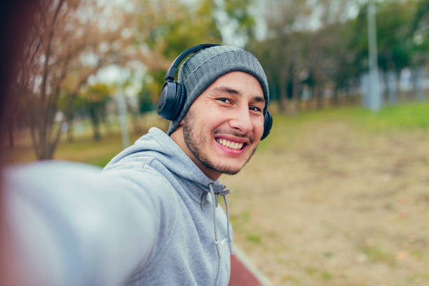 istock Happy Young Athlete Taking Selfie Photo in Nature 1086922736