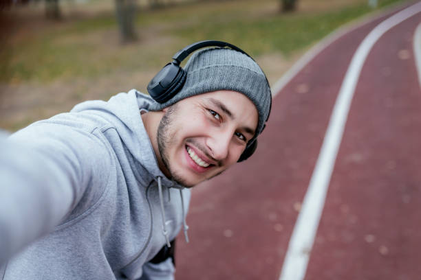 istock Happy Young Athlete Taking Selfie Photo in Nature 1086922832