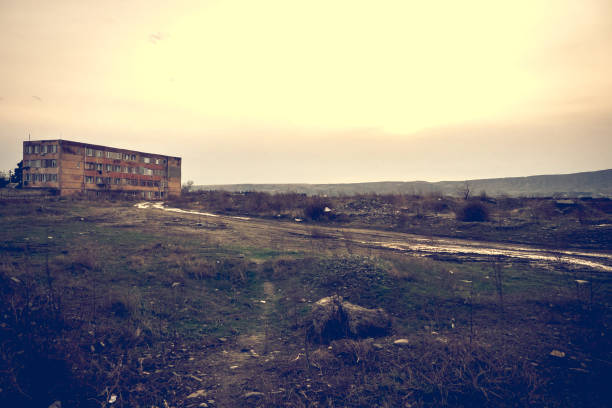 istock Hostel for the poor on wasteland. Hostel building at sunset. 1086924534