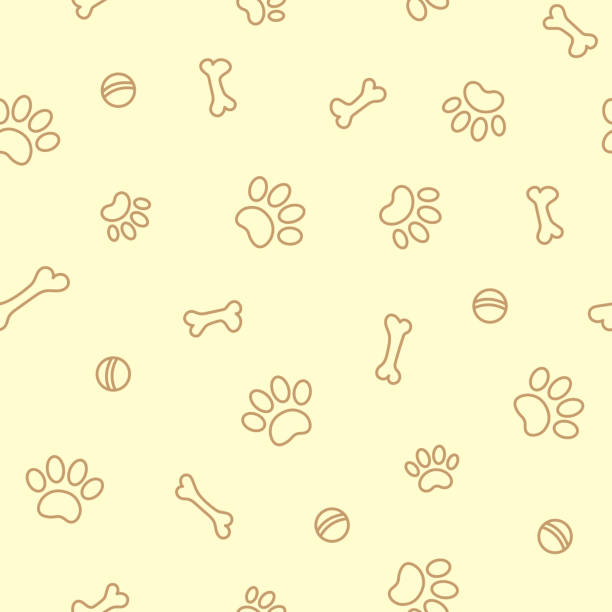 paw prints and bones on beige seamless pattern Paw prints and bones on a light yellow background seamless pattern. beige background illustrations stock illustrations