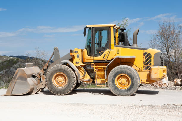 istock Heavy yellow wheel loader excavator, close-up. 1086929308