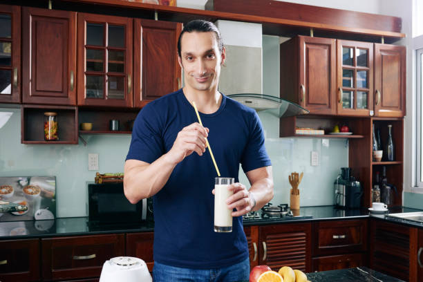 istock Cheerful man with milk cocktail 1086930196