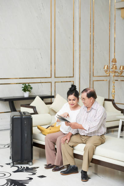 istock Hotel guests in hotel hall 1086931772