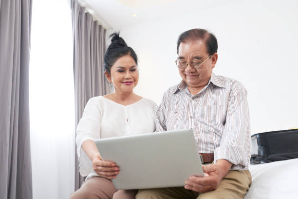 istock Aged couple watching videos 1086931816