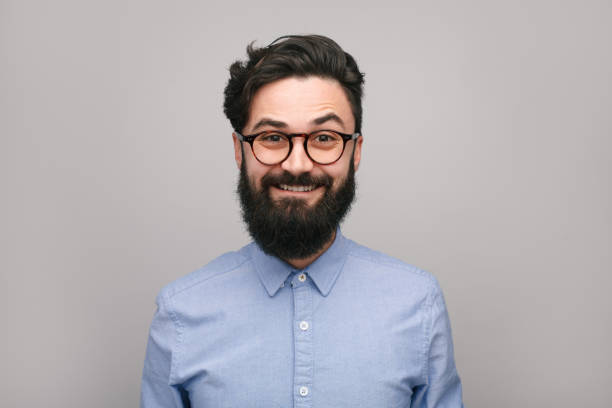 istock Smiling bearded man in shirt and eyeglasses 1086941038