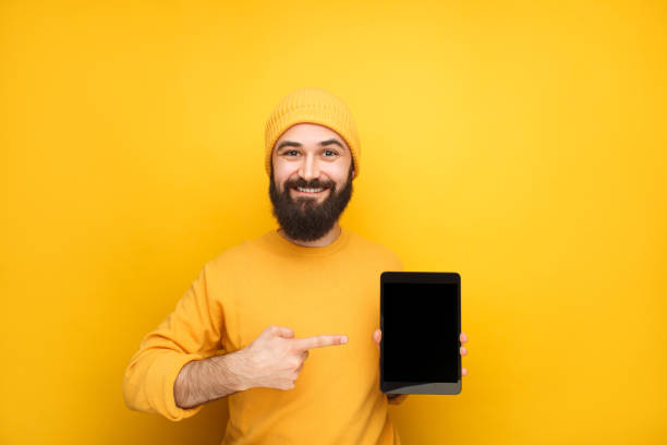 istock Cheerful colorful hipster advertising tablet 1086941050
