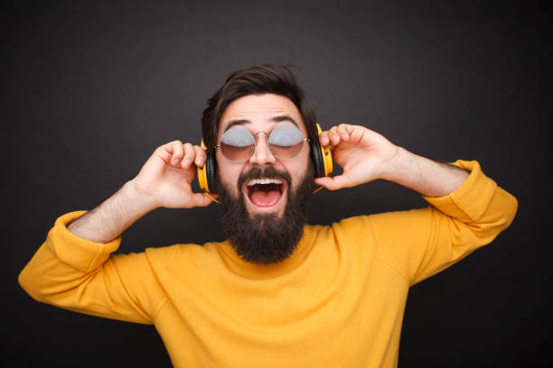 istock Bright hipster listening to music 1086941064