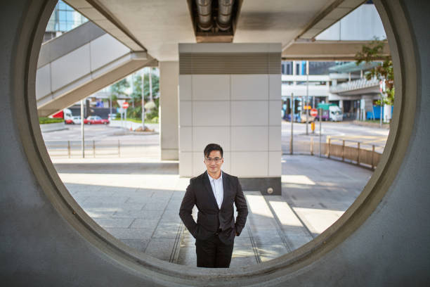 istock Confident businessman seen through circle in city 1086945014