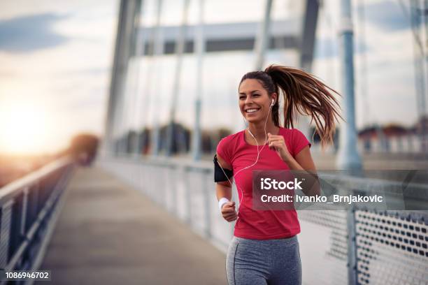 Female Running In The City Stock Photo - Download Image Now - Running, Women, Exercising