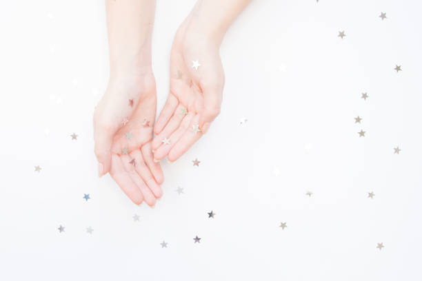 istock Woman`s hands and branches of spruce on a white background. Christmas concept. Top view. 1086950896