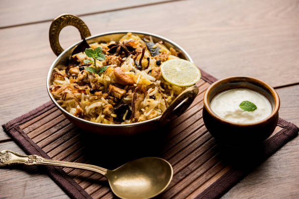 istock Keema or Kheema Biryani - Fragrant and spicy minced lamb or goat or chicken cooked in range of aromatic spices with basmati rice. served in a karahi with curd. selective focus 1086961302