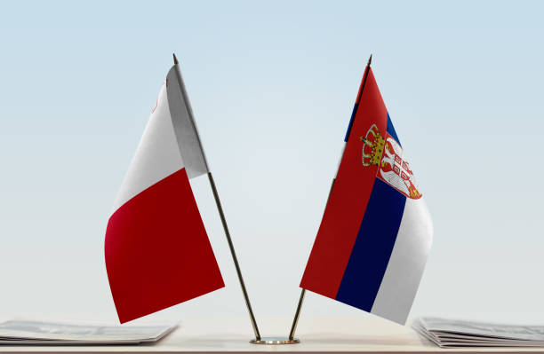 istock Flags of Malta and Serbia 1086968082