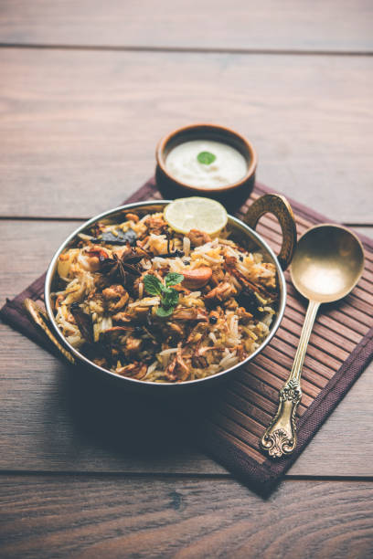 istock Keema or Kheema Biryani - Fragrant and spicy minced lamb or goat or chicken cooked in range of aromatic spices with basmati rice. served in a karahi with curd. selective focus 1086971470