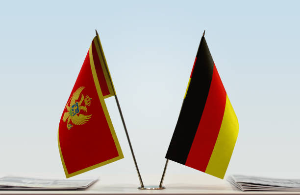 istock Flags of Montenegro and Germany 1086973976