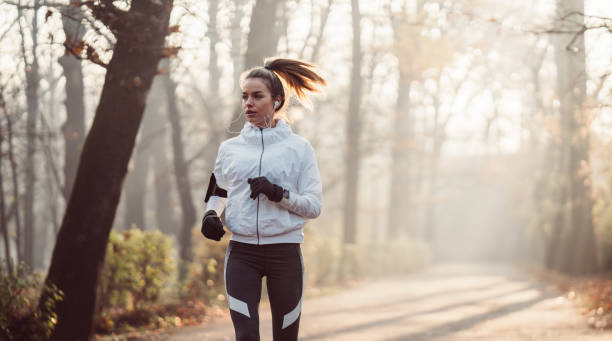istock Woman jogging in park 1086976828