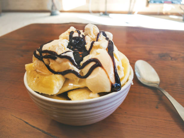 Vanilla Ice Creme in a Bowl with Chocolate Sauce and Bananas