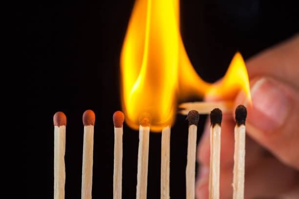 istock group of burn and unburned matches, isolated on black background 1086988298
