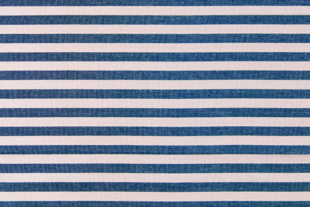 Blue and white stripes fabric background,  kitchen towel texture.