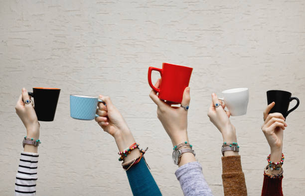 Many different hands holding coffee cups. Many different hands holding coffee cups. Coffee break. cup of tea hands stock pictures, royalty-free photos & images