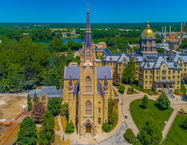University of Notre Dame The University of Notre Dame Office of Admissions, Basilica of the Sacred Heart, and Washington Hall. indiana photos stock pictures, royalty-free photos & images