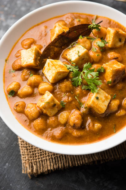 istock Chole Paneer curry made using boiled chickpea with cottage cheese with spices. Popular North Indian recipe. served in a bowl or serving pan. Selective focus 1086995902