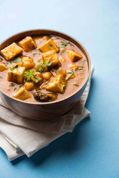 istock Chole Paneer curry made using boiled chickpea with cottage cheese with spices. Popular North Indian recipe. served in a bowl or serving pan. Selective focus 1086996242