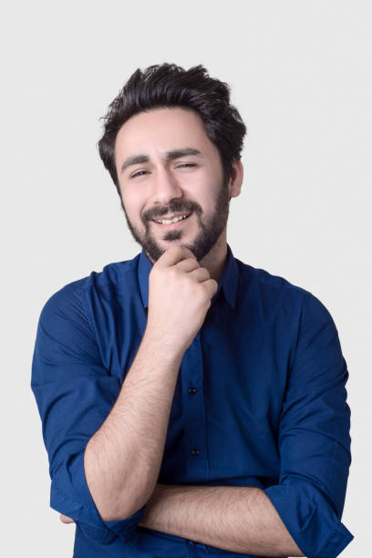 istock Portrait of smiling proud young man 1086998068