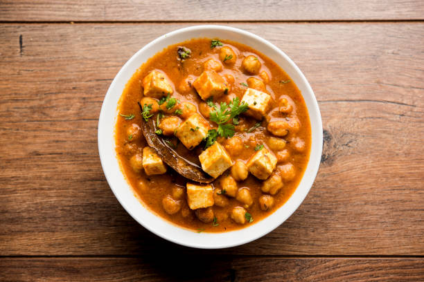 istock Chole Paneer curry made using boiled chickpea with cottage cheese with spices. Popular North Indian recipe. served in a bowl or serving pan. Selective focus 1086999186