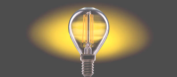 silhouette lampe led fond jaune. - piggy bank savings investment glasses photos et images de collection