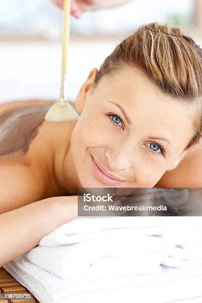 Portrait Of A Beautiful Woman Receiving Beauty Treatment With Mud Stock Photo - Download Image Now