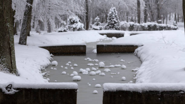 istock A small decorative bridge across a small river in a snowy winter park 1087011732
