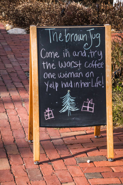 Sandwich, Massachusetts, USA--December 20, 2018- In reaction  to a negative Yelp review, a cafe in town posted a blackboard sign inviting the passing public to offer their opinion.