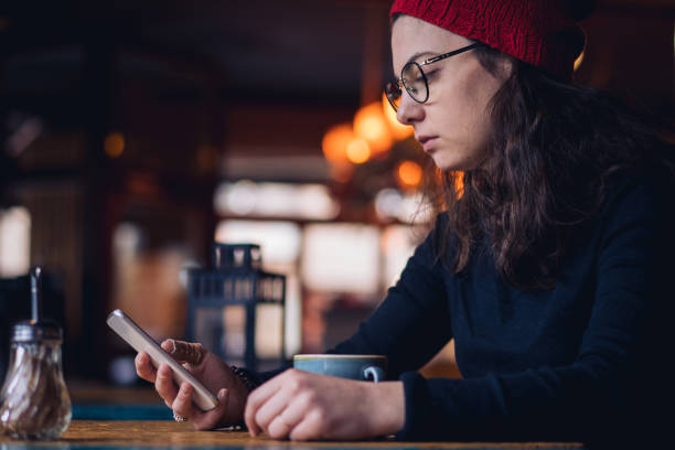 istock Woman spending relaxing time at cafe 1087023990