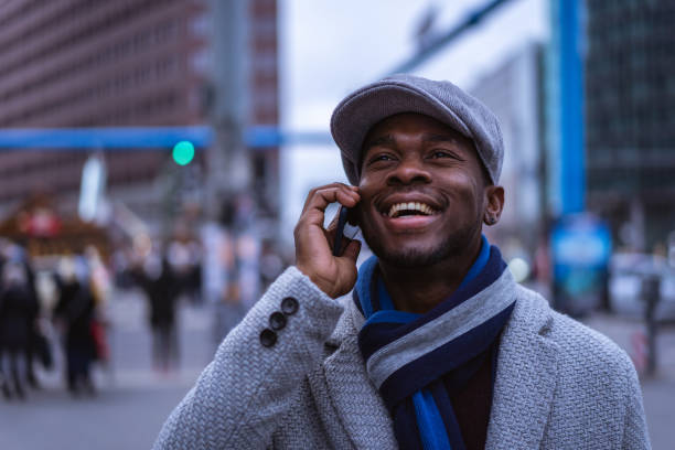 istock Businessman using smart phone on the street 1087025448